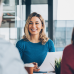 Business woman smiling in meeting