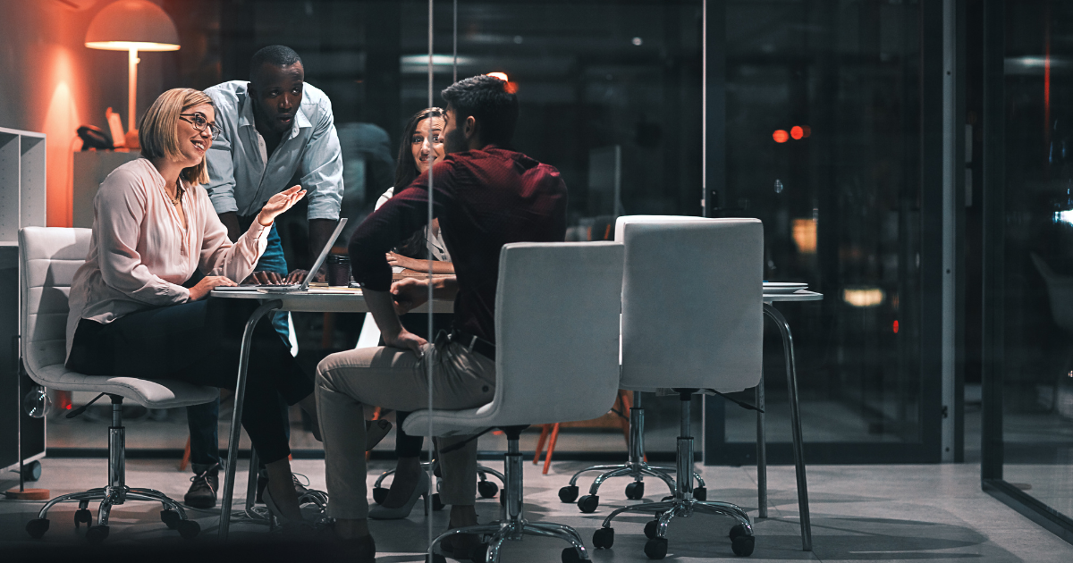 Employees at an evening meeting