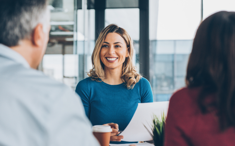 Business woman smiling in meeting