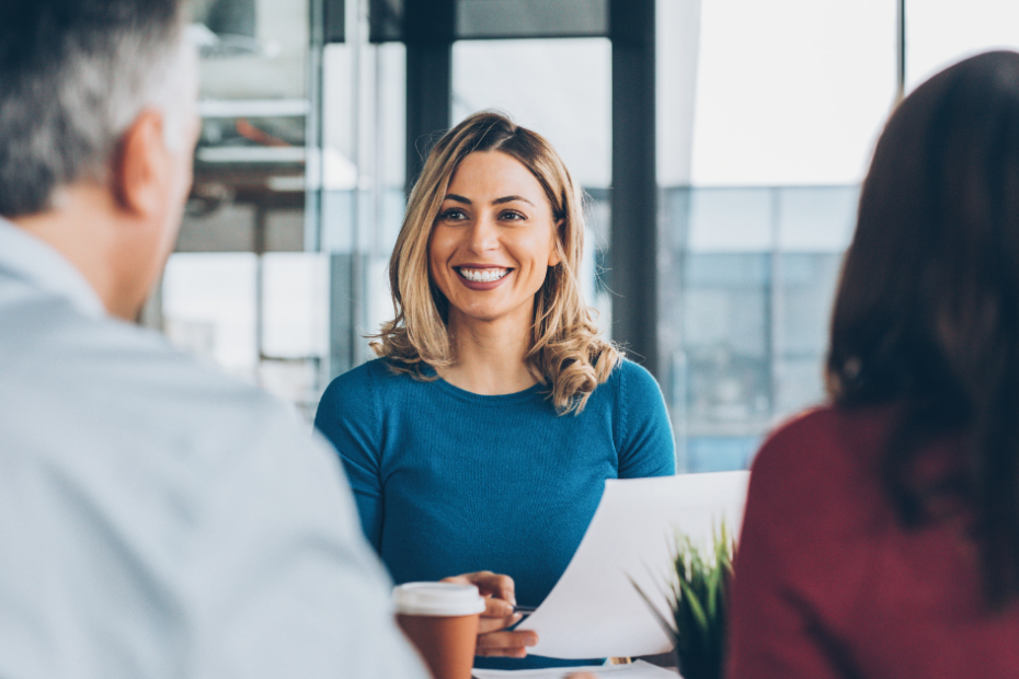 Business woman smiling in meeting