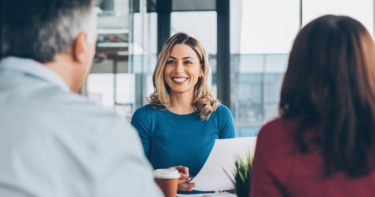 Business woman smiling in meeting