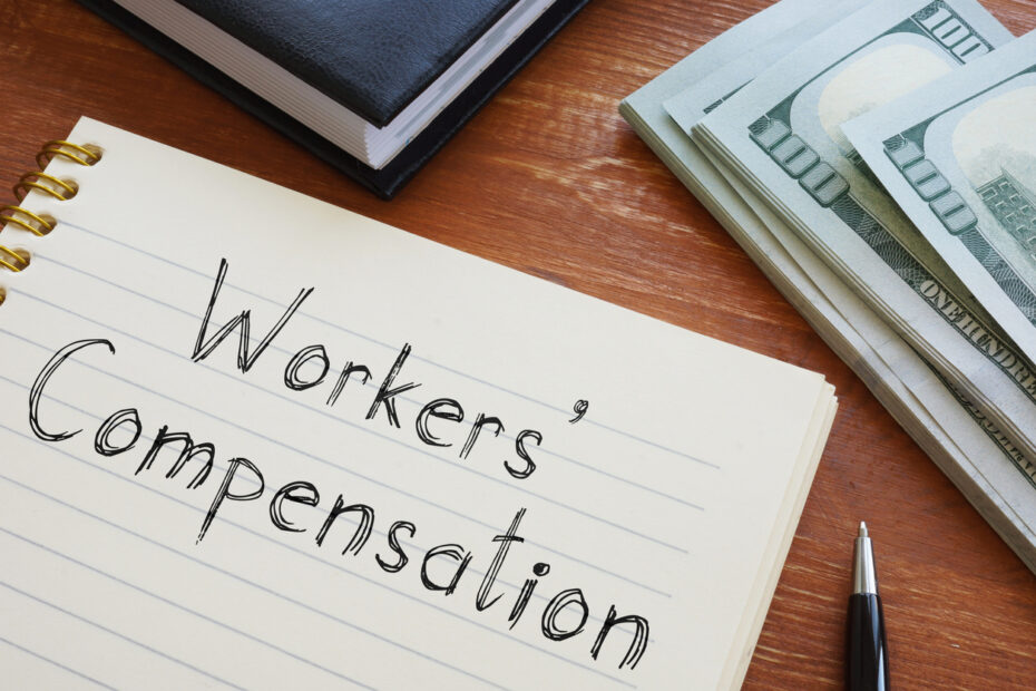 Workers' Compensation written on notepad on desk