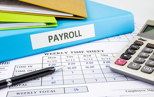 Payroll binder on top of time sheet