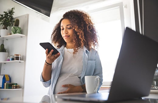 Pregnant woman working from home