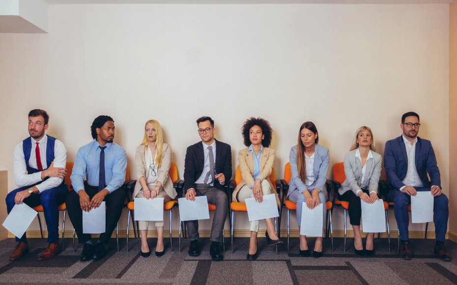 Individuals sitting in office with job application