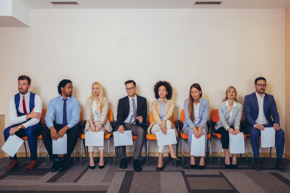 Individuals sitting in office with job application